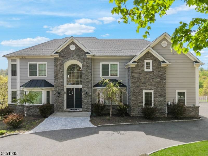 Nestled in a private section of Watchung is this magnificent turn key property with breathtaking valley views.