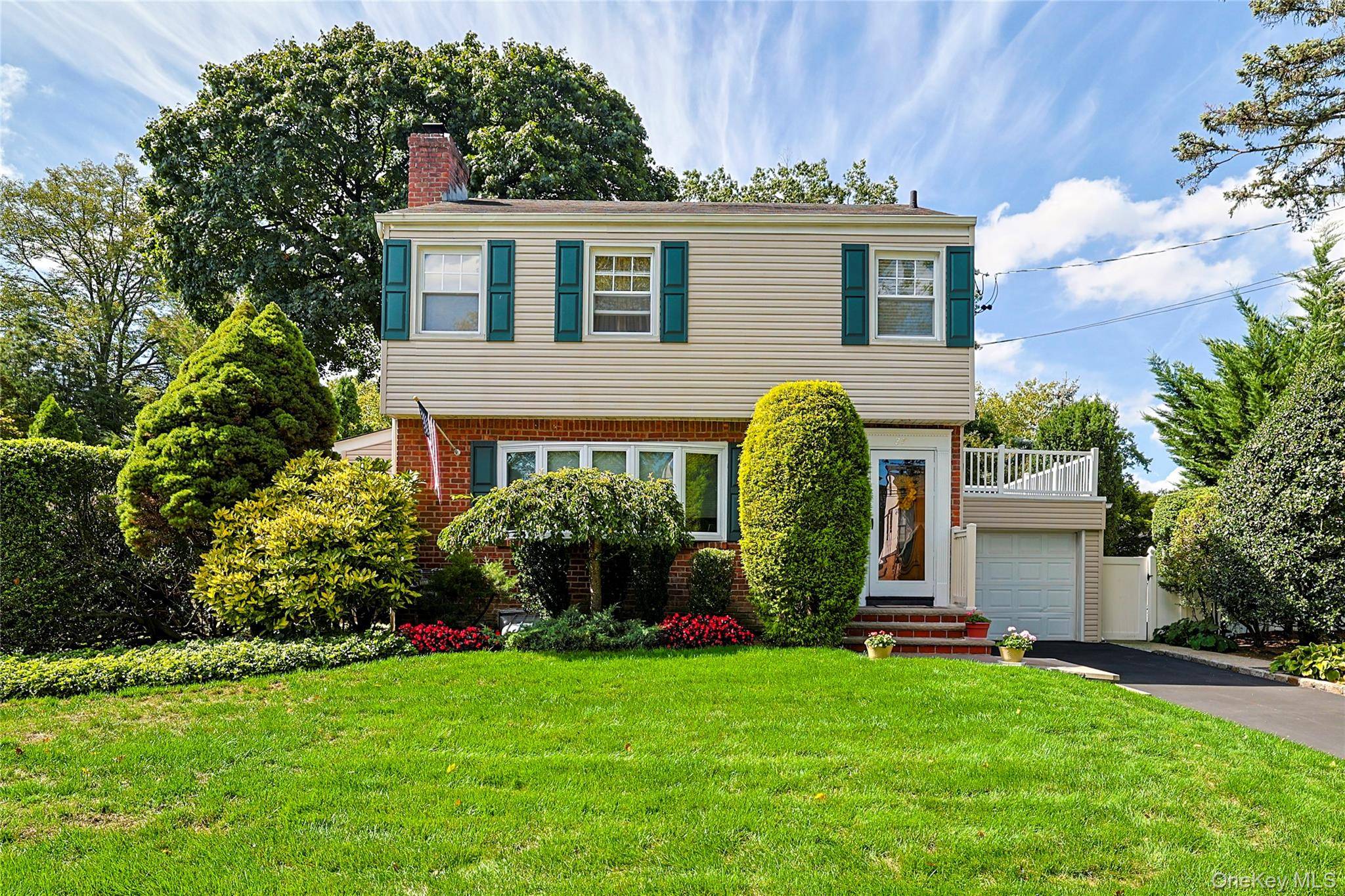 Welcome to this timeless Colonial, perfectly situated on an expansive 90x100 property in the highly sought after Westwood section of Malverne.