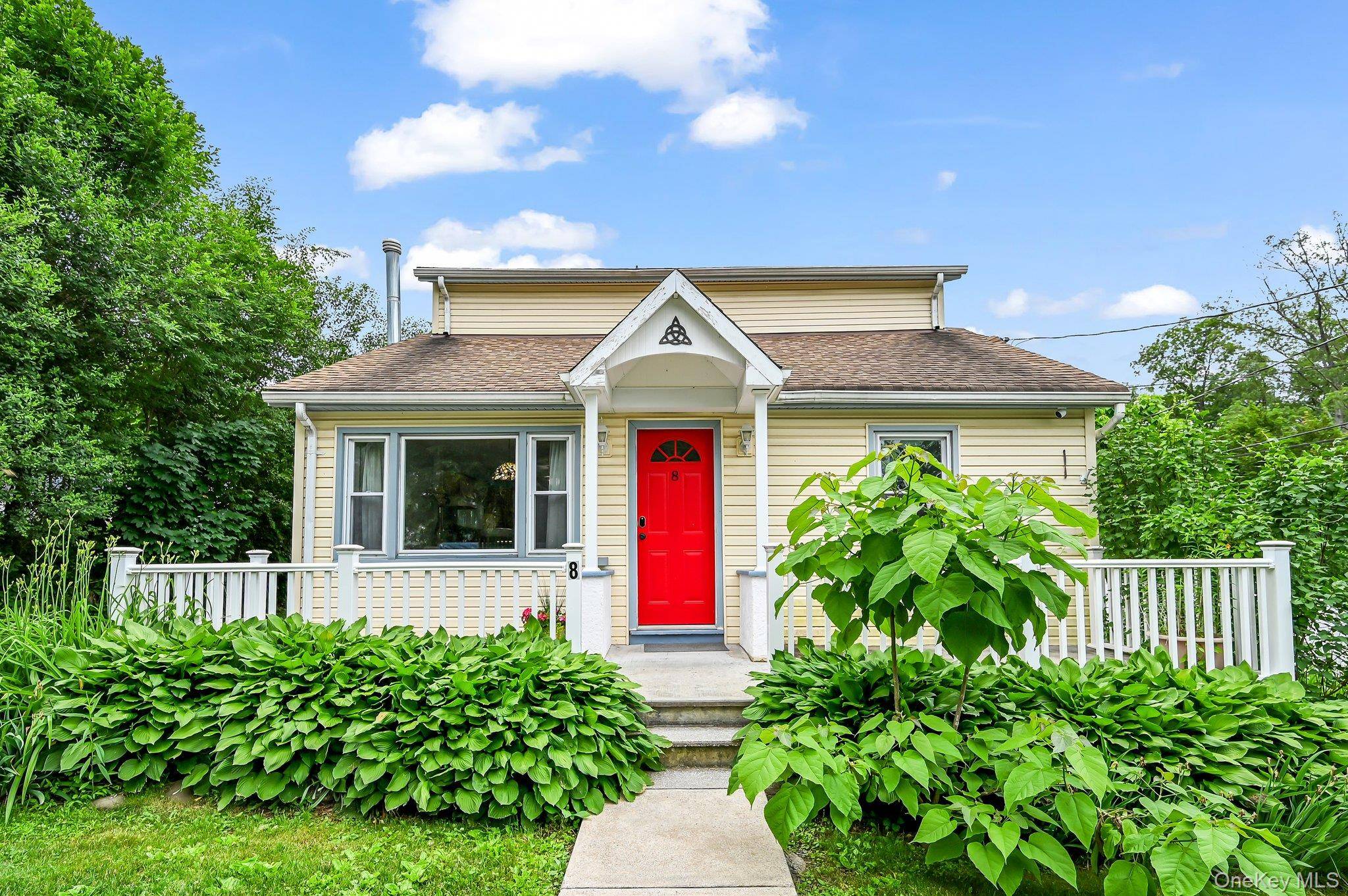 Welcome to 8 Stellar Drive a warm and inviting Cape Cod nestled in the scenic hills of Greenwood Lake, within the charming Lake Lands community.