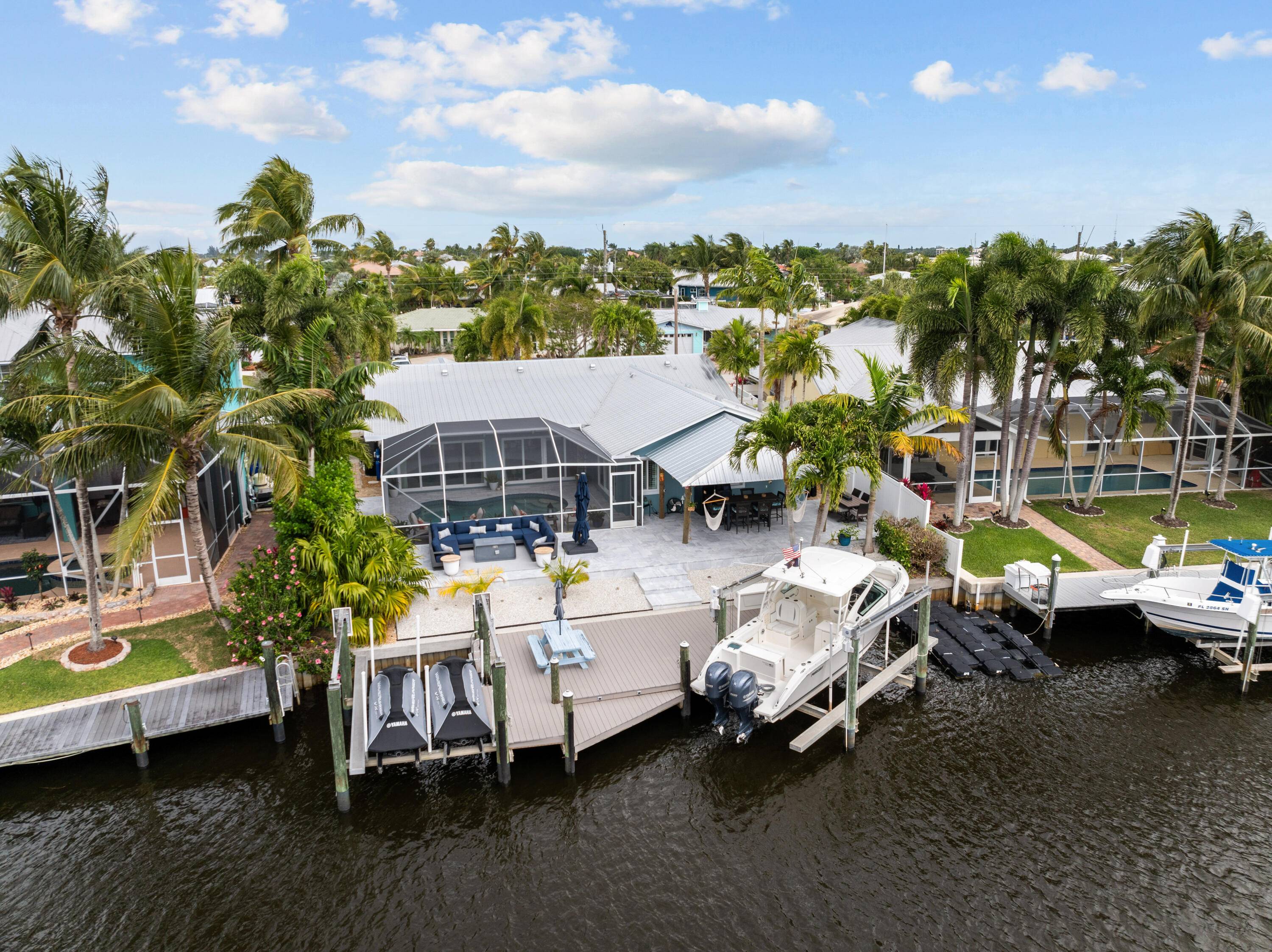 WATERFRONT, OCEAN ACCESS 4 bed open concept, split plan pool home located in Lighthouse Point in Palm City !