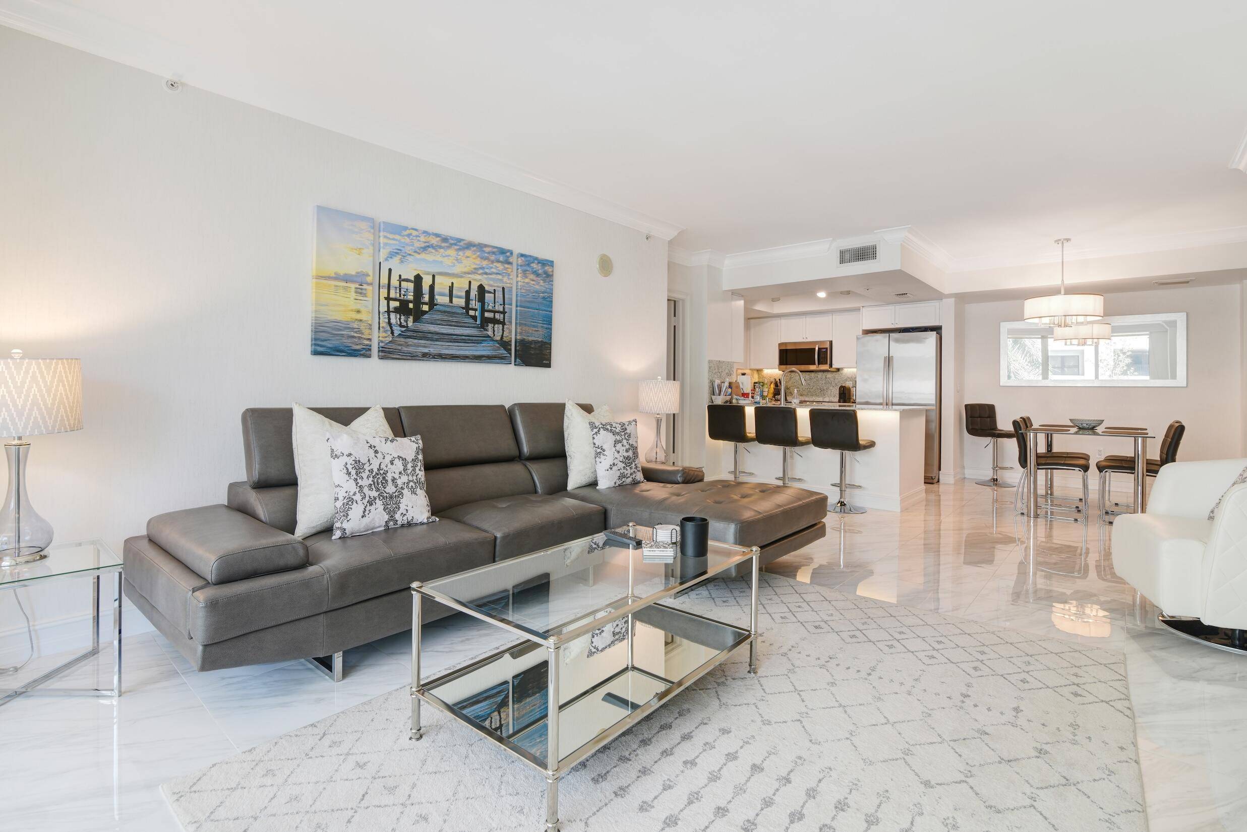 Absolutely perfect 2BR 2BA fully furnished condominium in the prestigious Palmetto Place, this residence offers a sophisticated urban lifestyle with split bedrooms, open white kitchen and porcelain floors throughout.