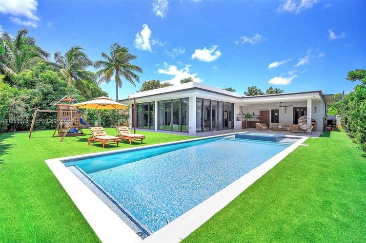 Stunning residence built in 2023 in the desirable North Miami area, located in Biscayne Gardens.