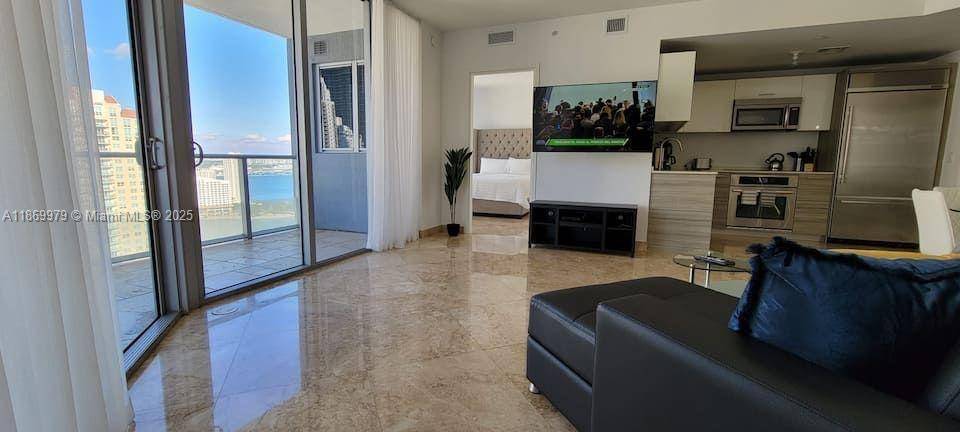 Live in this sophisticated condo in Miami's most desirable neighborhood.