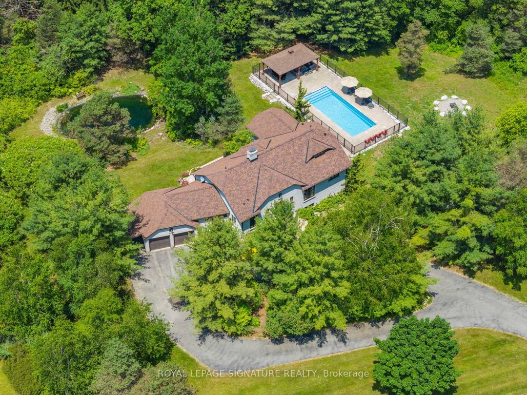 Welcome to 30 Kingswood Drive A European Inspired Bungalow on a Lush 2 Acre Estate This stunning executive home on a beautifully landscaped 2 acre lot offers the perfect blend ...