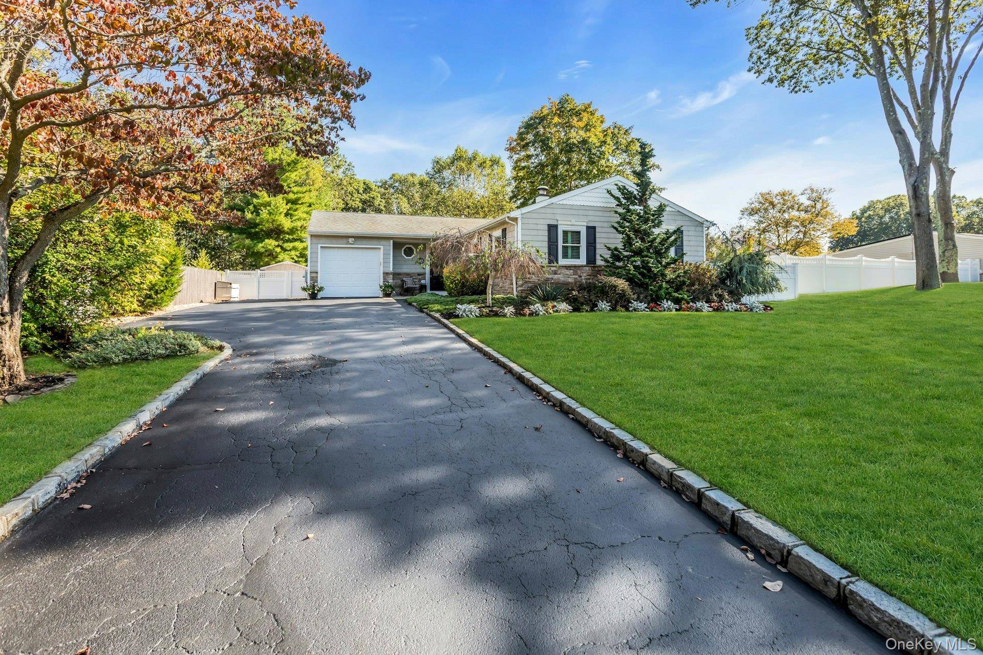 Tucked away on a quiet dead end street, this charming ranch offers both privacy with a beautiful natural backdrop.