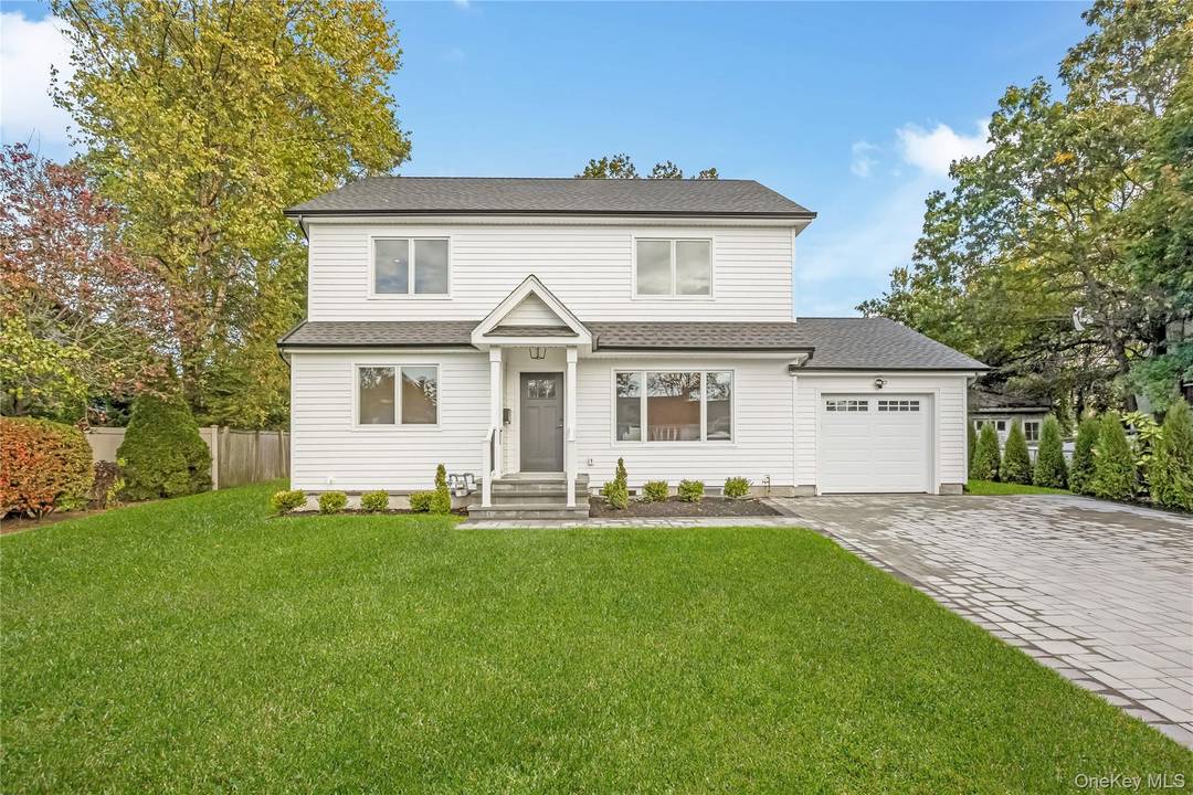 Experience the pinnacle of luxury living in this brand new construction home, nestled in the highly sought after 'Forest Lake' section of Wantagh, New York.