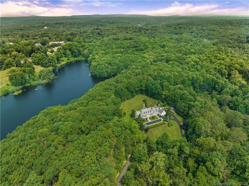 Welcome to a truly exceptional New Canaan architectural masterpiece built in 2004, nestled on a majestic private lane occupied by only 6 estates, enveloped by serene forests and 48 acres ...