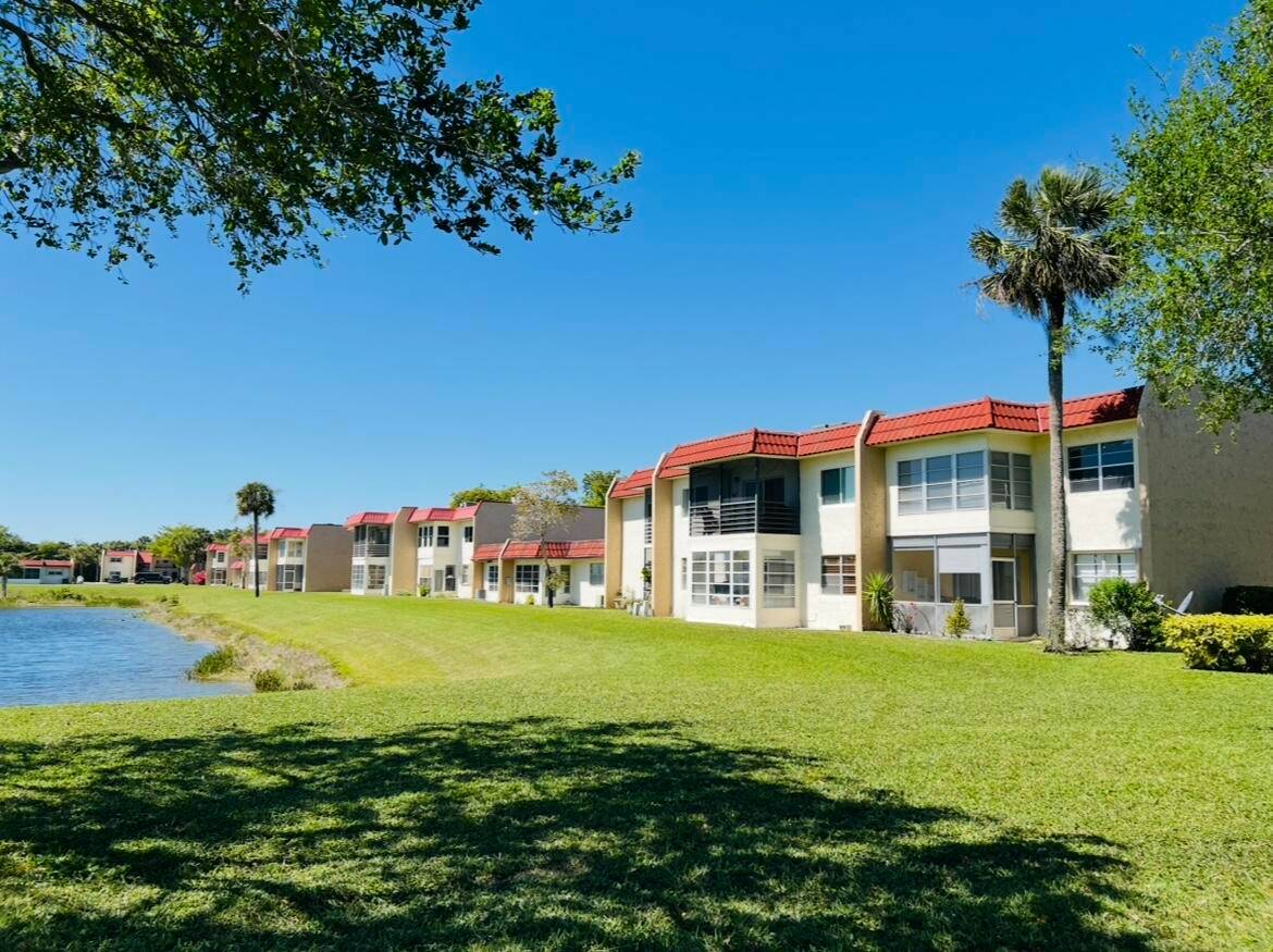 Just listed ! Sweet and cozy, second floor, corner unit home tucked away in beautiful Golden Lakes Village.