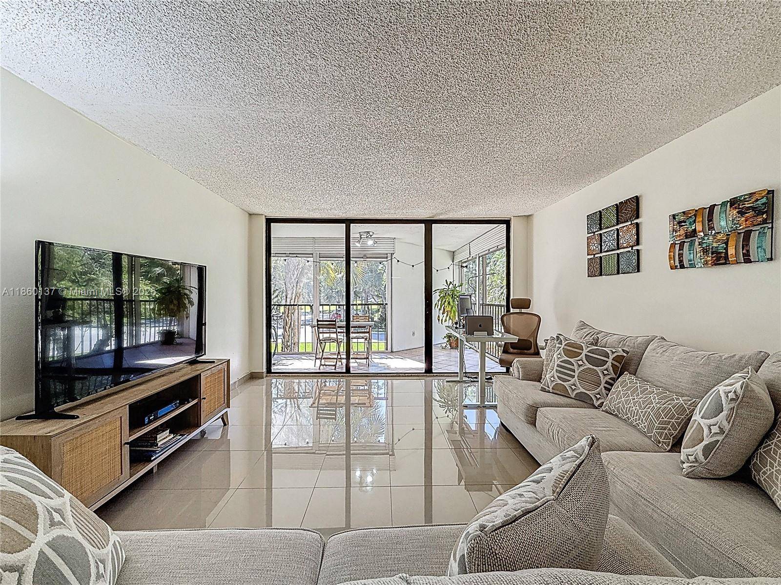 Corner Unit located in the desirable Country Club Village at Weston !