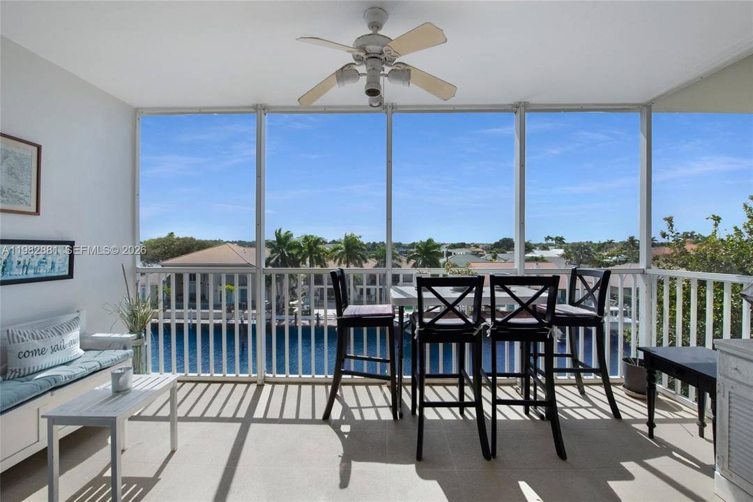 Enjoy waterfront living from this penthouse corner residence in the desirable Palm Aire at Coral Key community in Lighthouse Point.