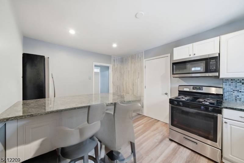 Welcome to this beautifully updated 3 bedroom, 2 full bathroom home in the heart of Manville.