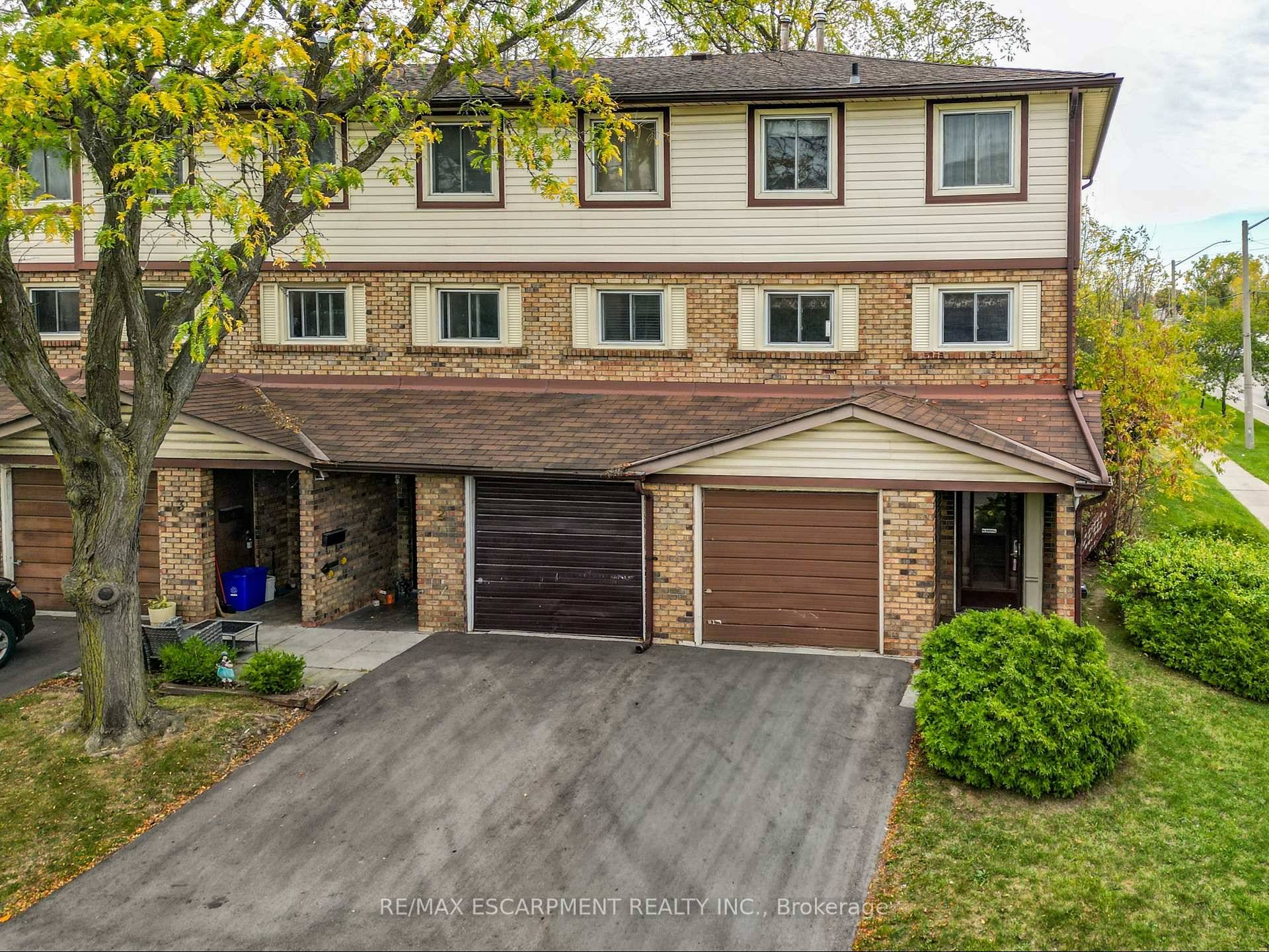 TRADITIONAL CHARM... Experience the vintage character of yesteryear blended with everyday functionality in this traditional end unit condo townhome at 1 34 Bow Valley Drive in desirable Stoney Creek.
