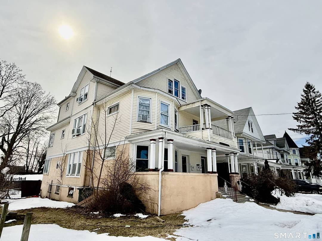 Spacious and Stately 3 Family home with great curb appeal and high ceilings in most rooms.