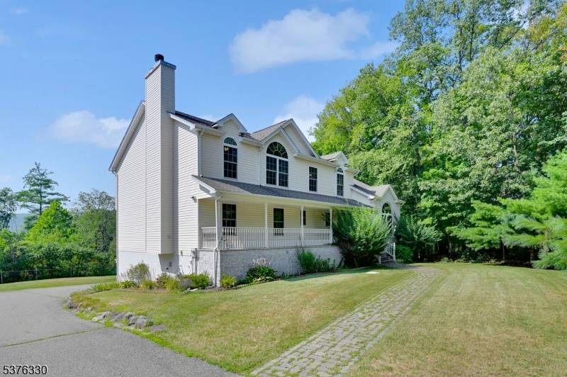 Sprawling Colonial With Expansive Living Spaces !