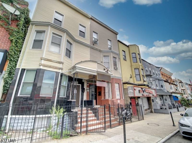 Spacious 2 Family Home in the heart of North Newark featuring 11 Bedrooms, 6 Full Baths, Bonus Attic Basement that are completely finished !