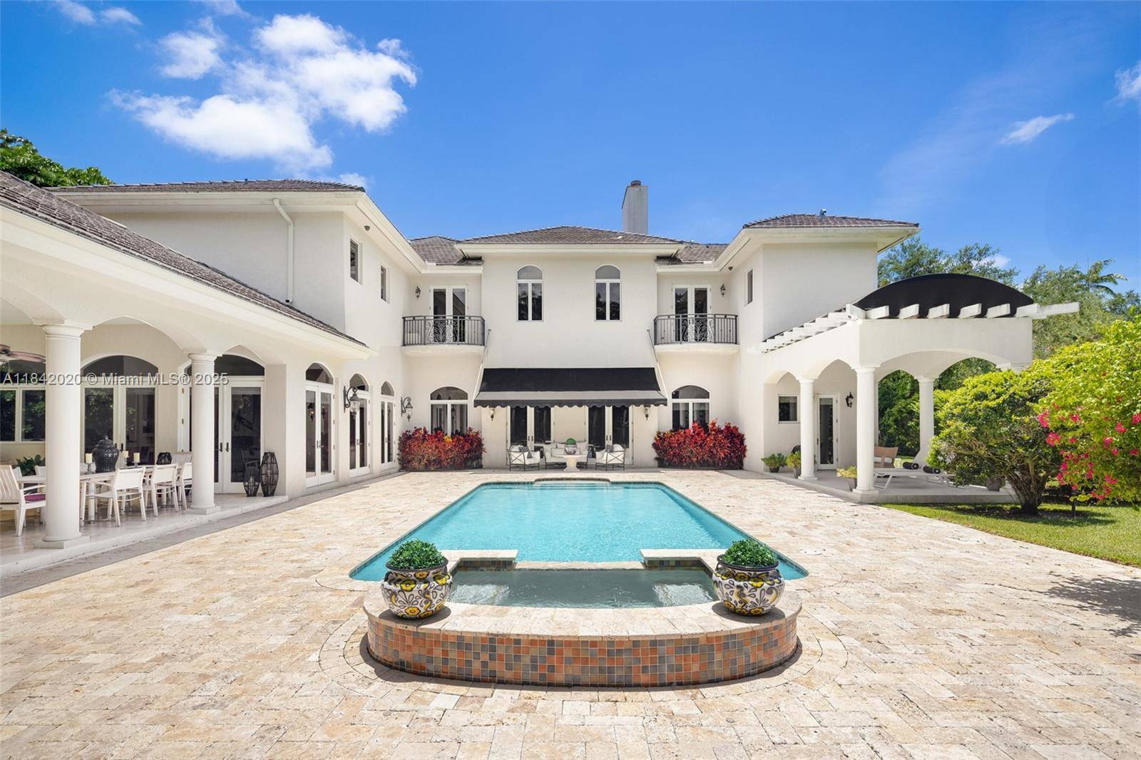 Nestled in the exclusive Ponce Davis neighborhood, this timeless French inspired estate offers a blend of classic elegance and refined comfort.