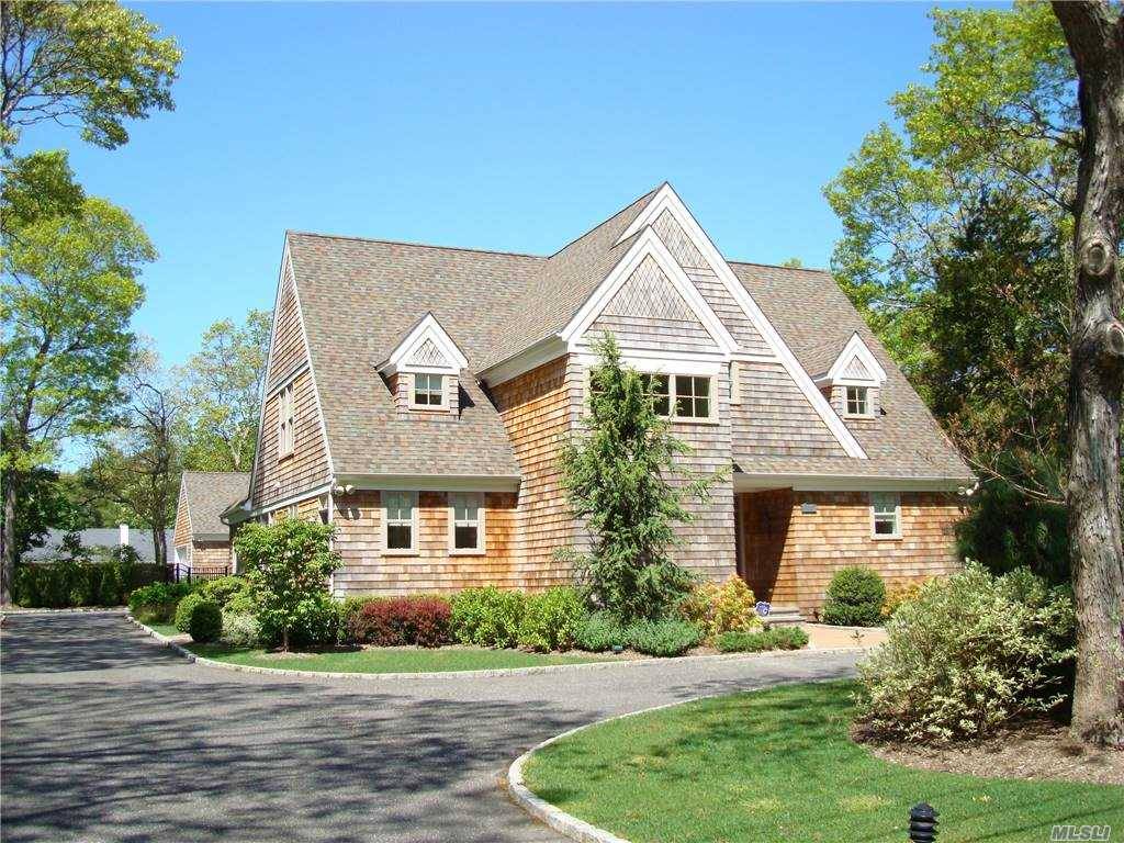 This Immaculate builders home is steps to village shopping and Rogers Beach.