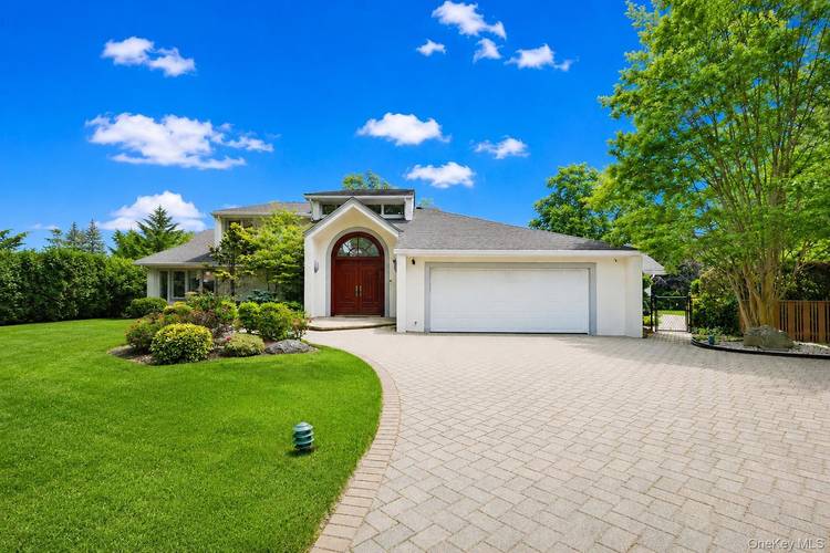 Expanded and completely remodeled Contemporary split level offering 5 bedrooms, 4 full bathrooms, and exceptional luxury living in the prestigious Hewlett Harbor community.