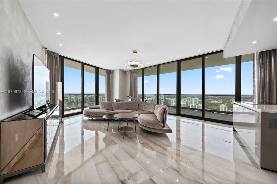 Experience elevated oceanfront living in this turnkey 45th floor corner residence at the prestigious Armani Residences.