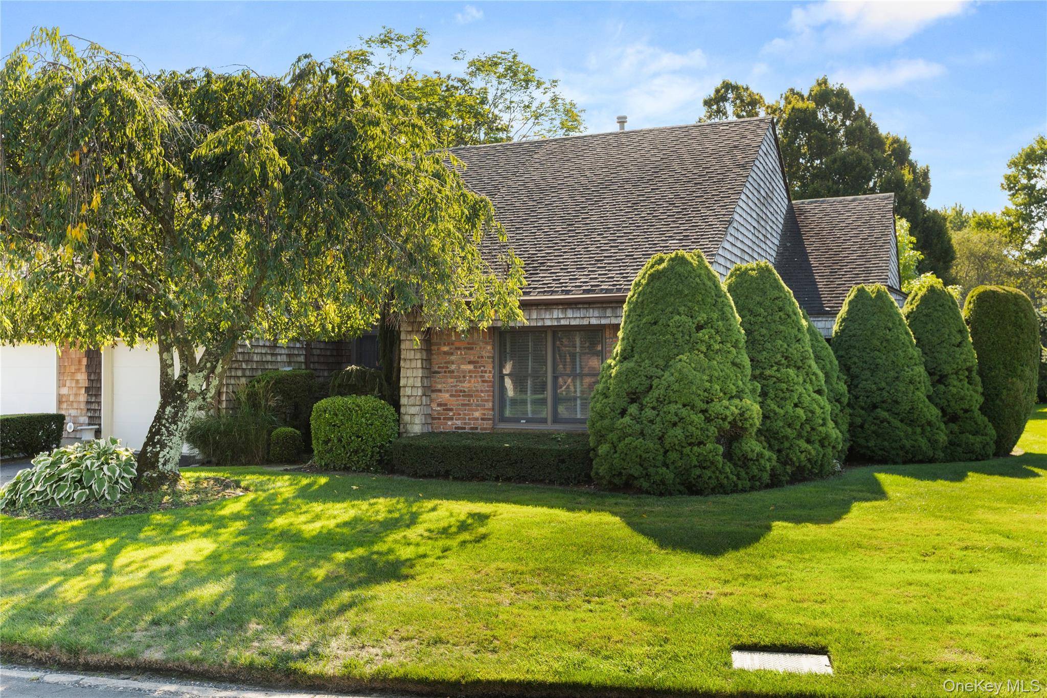 Discover comfort and privacy in this beautifully maintained single level ranch style condo nestled in the quiet and tranquil community of Baywoods.