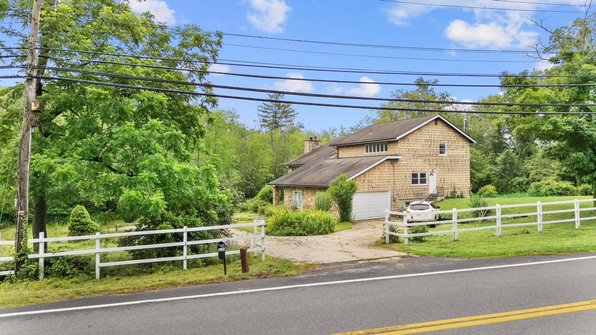 Move right in ! Enjoy easy living in this beautiful, sun filled, sprawling contemporary in Armonk with Byram Hills schools !