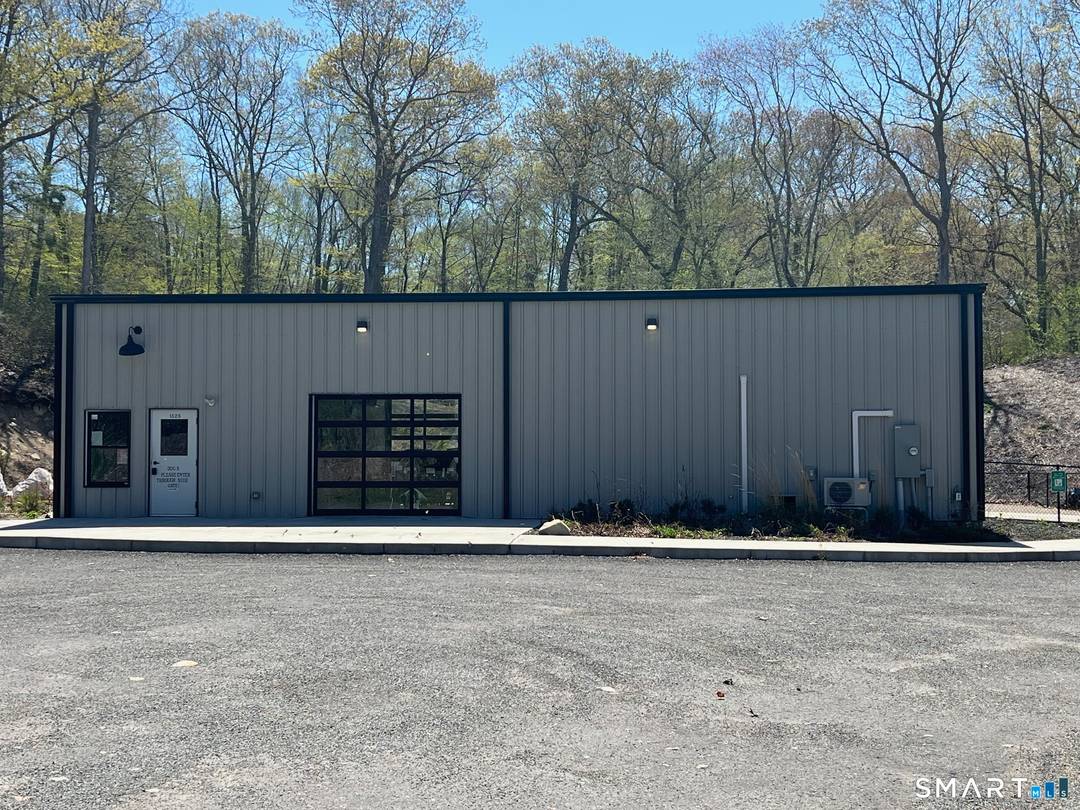 2, 400 SF commercial building with overhead doors, 14' ceiling, 2 handicap ramps.