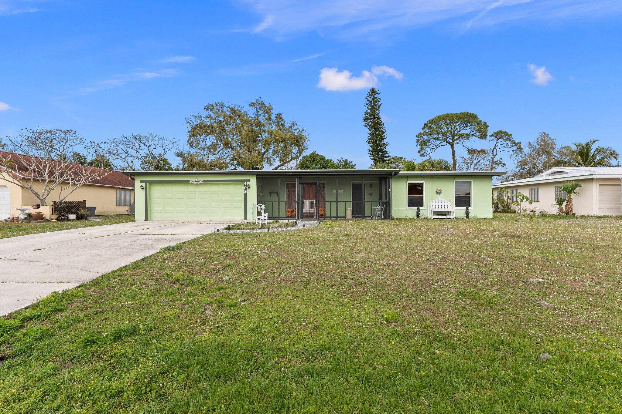 4 bedroom 2 bathroom 2 car garage pool home located in the heart of Port St Lucie.