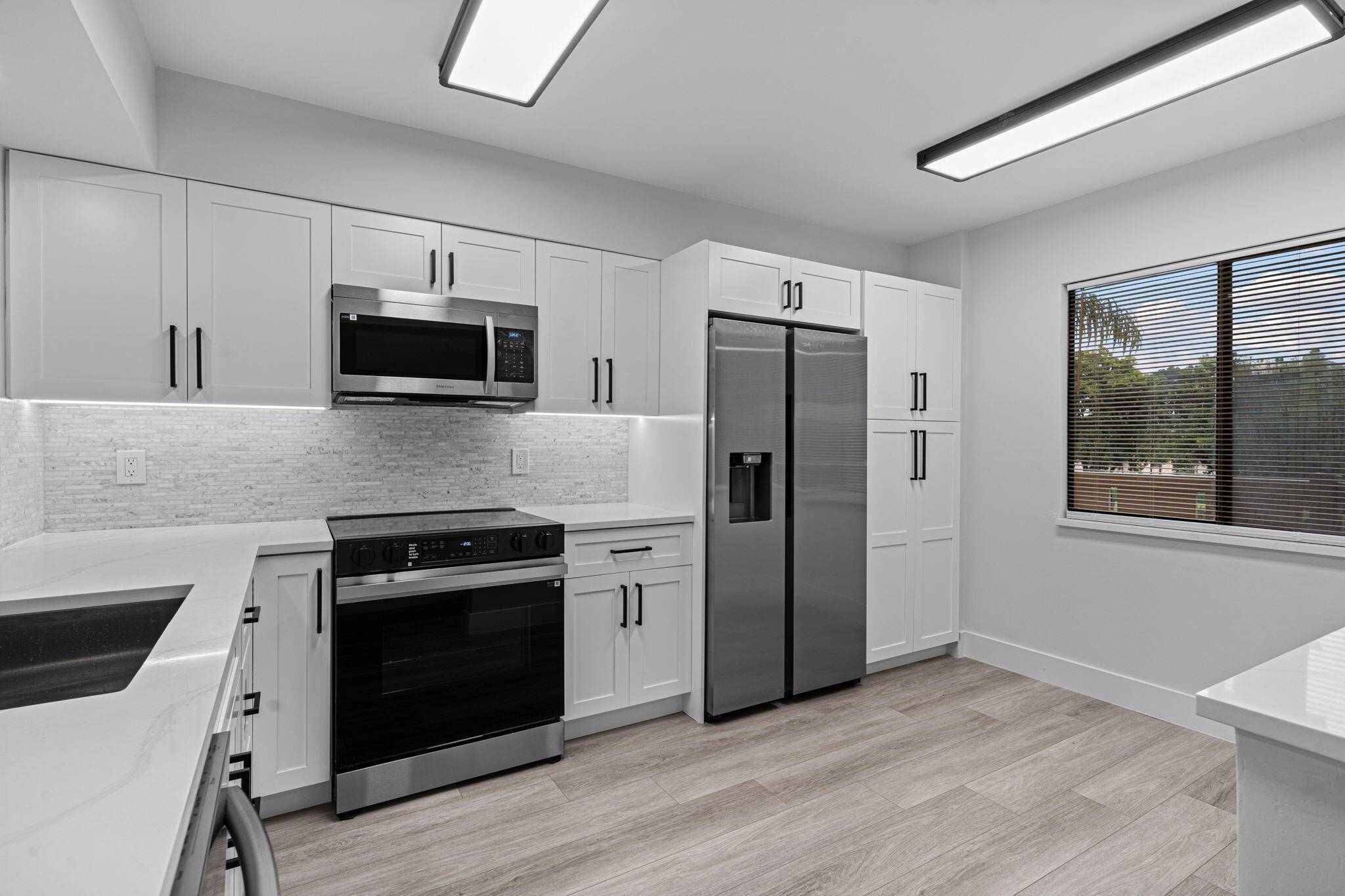 Step into luxury in this fully remodeled 2 bed, 2 bath corner condo unit in the highly sought after 55 community of Huntington Lakes.