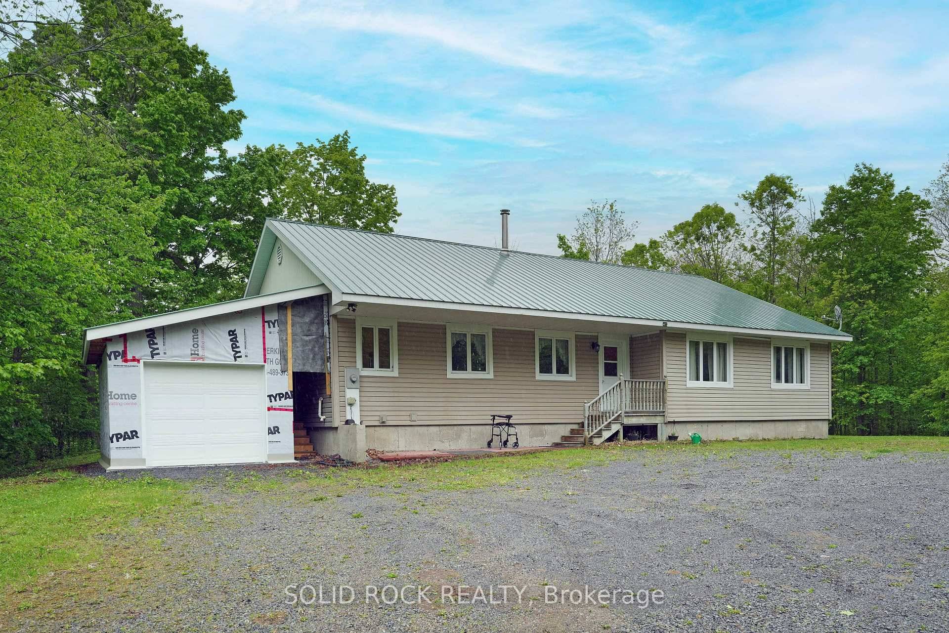 Spacious 4 bedroom, 2 bath bungalow set on over 11 acres in the quiet village of Vernon with potential to develop the land into a small subdivision.