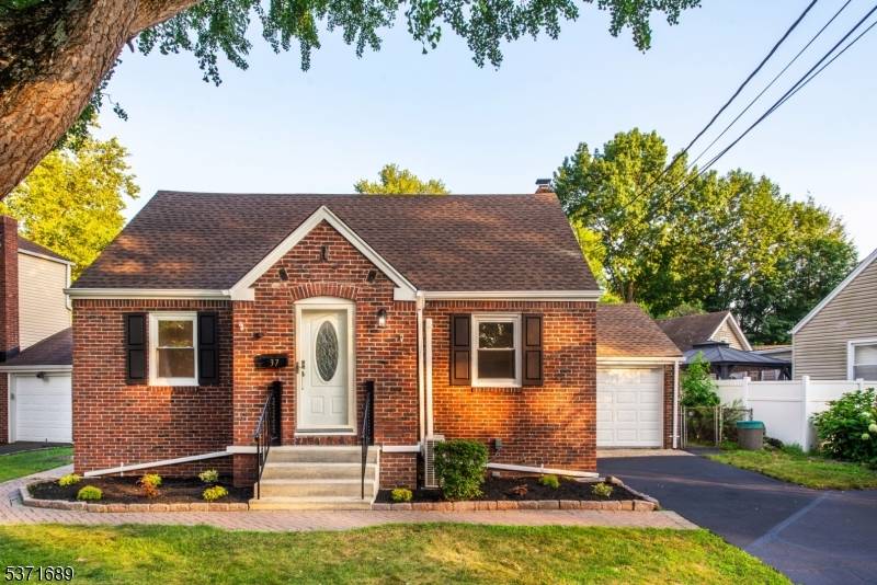 Captivating and meticulously renovated home nestled in a highly sought after neighborhood of a desirable town of Dumont.