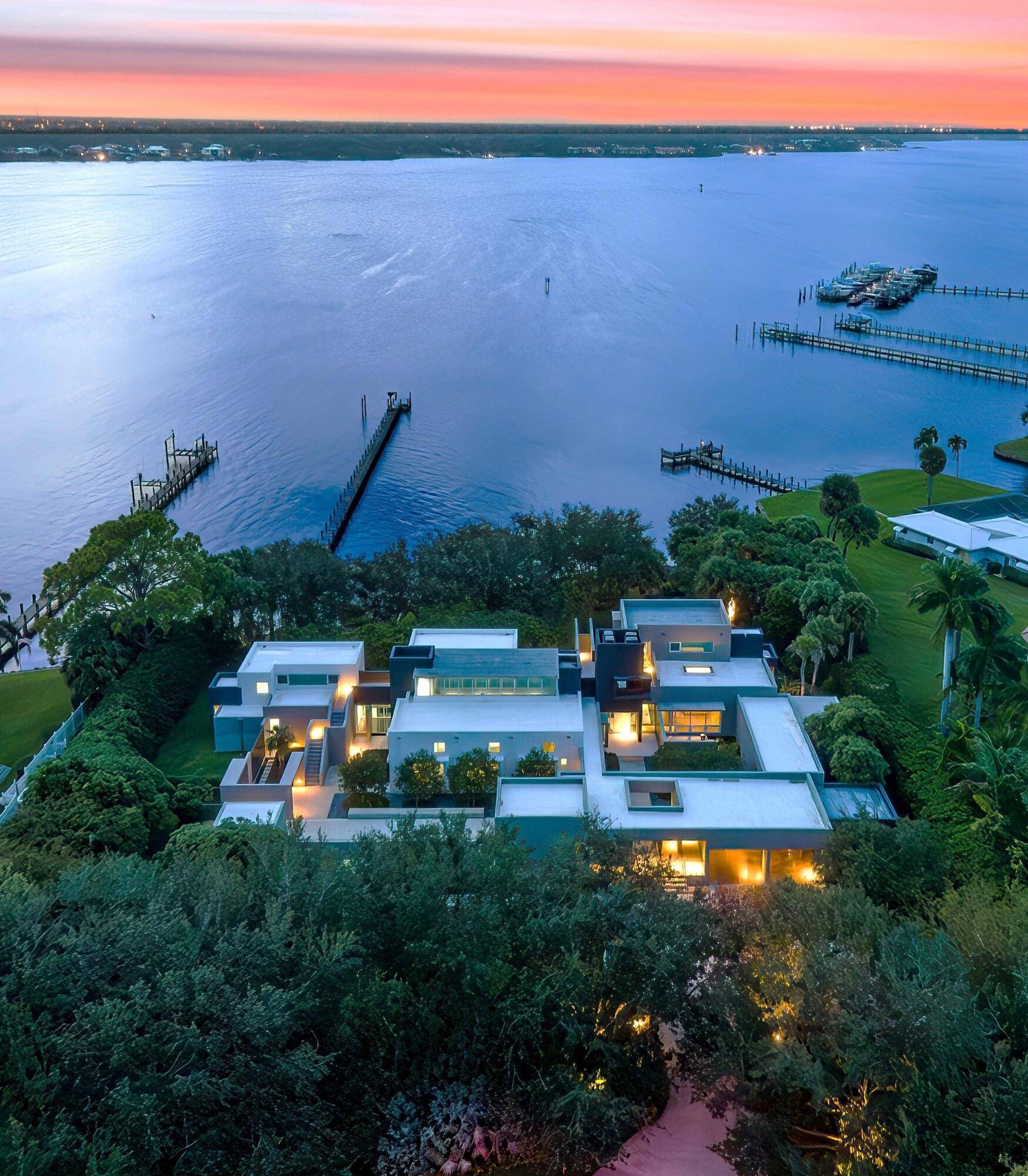 Set on an expansive double riverfront lot, this extraordinary residence boasts over 200 feet of protected shoreline, ensuring privacy, tranquility, and an intimate connection to nature.