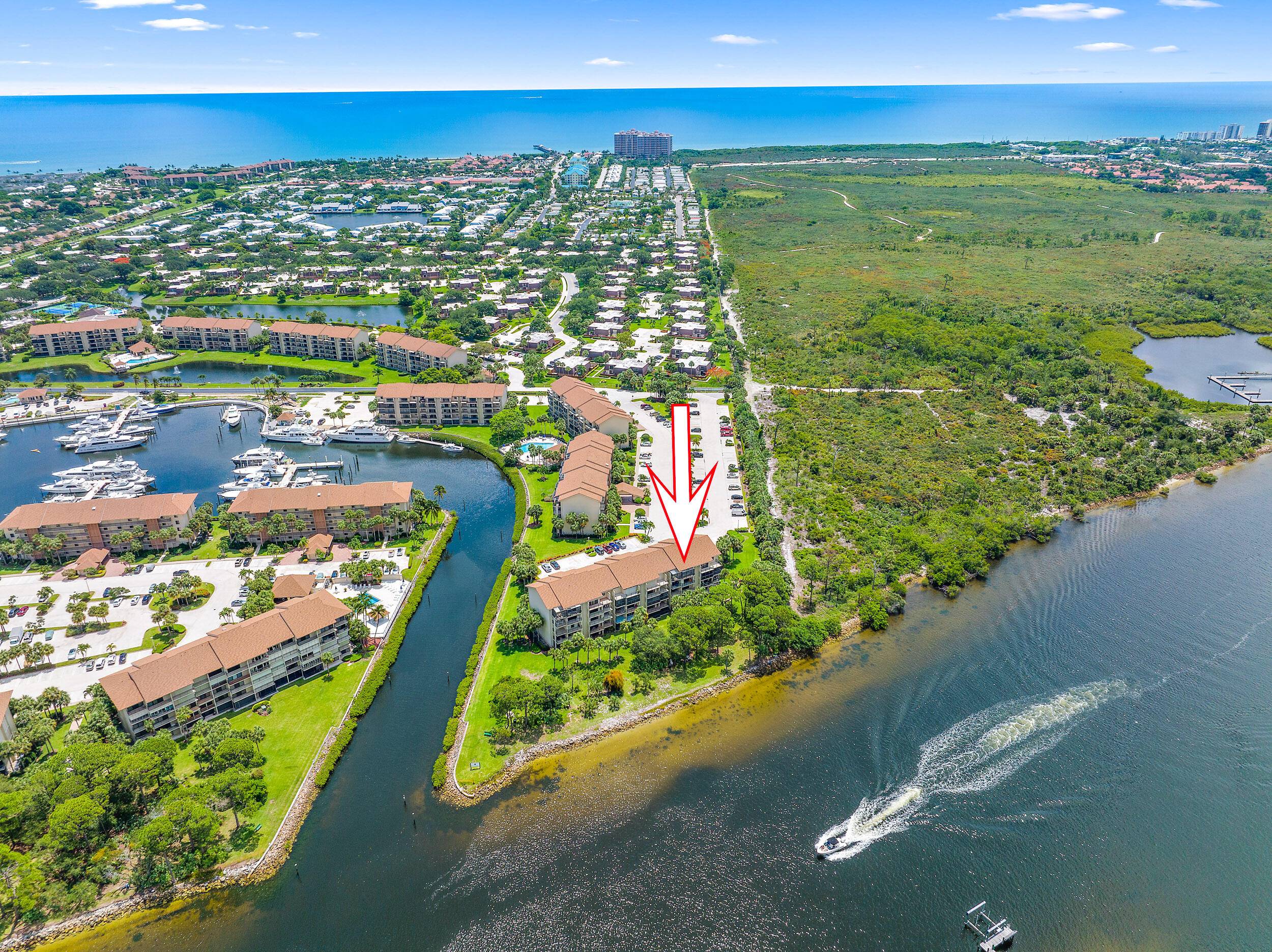 Incredible direct Intracoastal views with screened tiled patio entire width of condo in marina community.