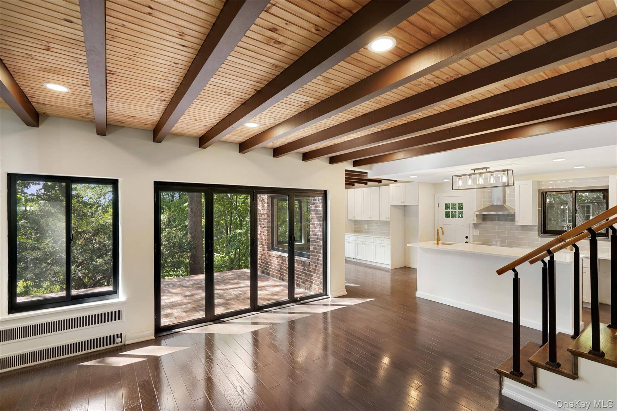 Presenting a complete interior and exterior renovation in design and construction showcasing contemporary bathrooms and an eat in kitchen with open concept living spaces !