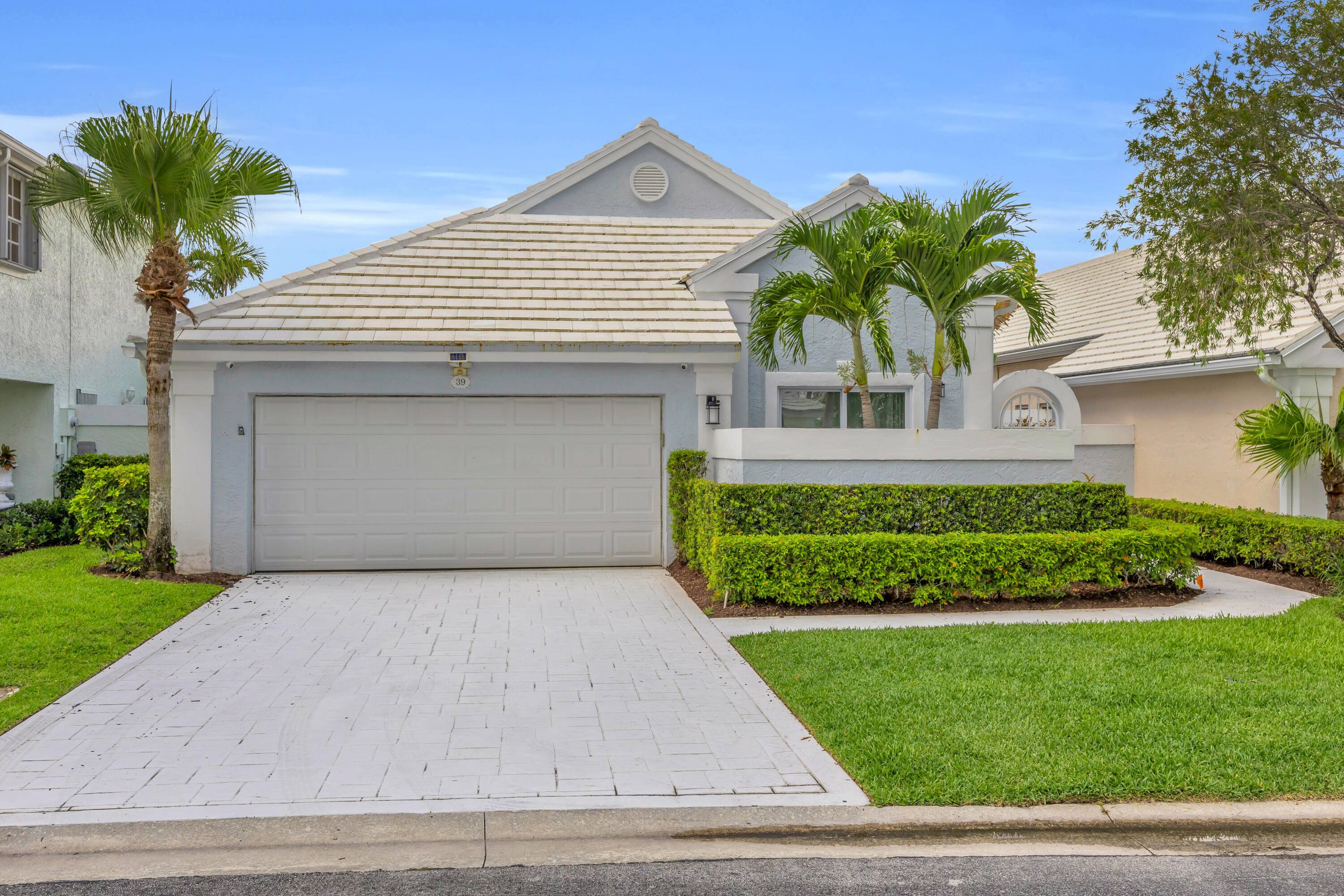 Welcome to this beautifully remodeled 3 bedroom, 2 bath home located in the prestigious PGA National community.