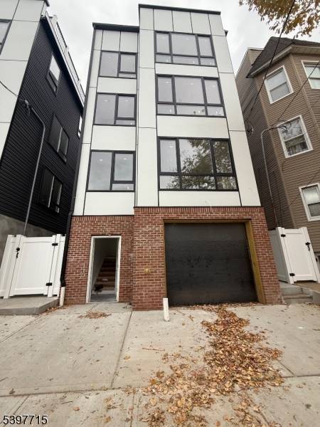 Welcome to this stunning three family masterpiece in one of Newark's most desirable locations !