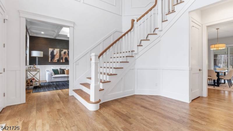 Experience luxury living in this custom 1 year old home, perfectly situated on an oversized lot backing to serene woods in Florham Park.