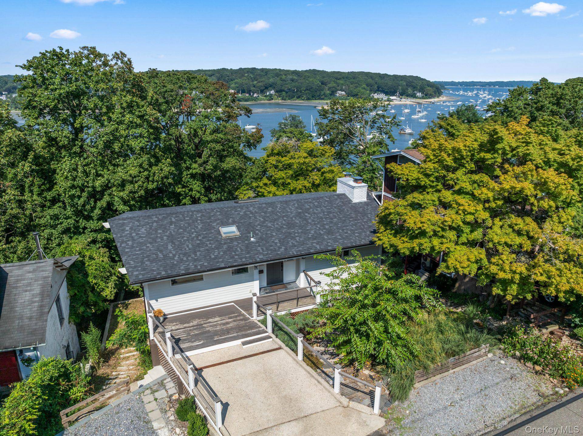 Quietly nestled just moments from Northport Harbor and the vibrant Village, this fully reimagined 3 bedroom, 2.