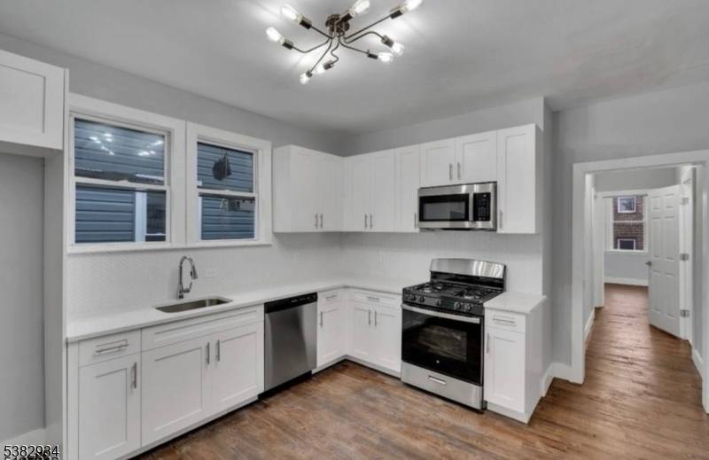 Excited to present this charming two family residence in Newark now on the market and move in ready.