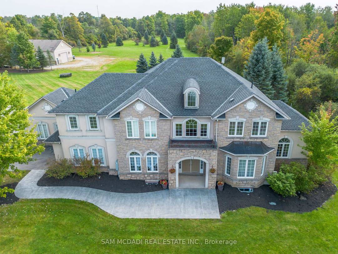 Welcome to this exquisite custom built home, nestled in a private estate of Brookville on a stunning 5 acre property, offering over 6, 000 square feet of luxurious living space.