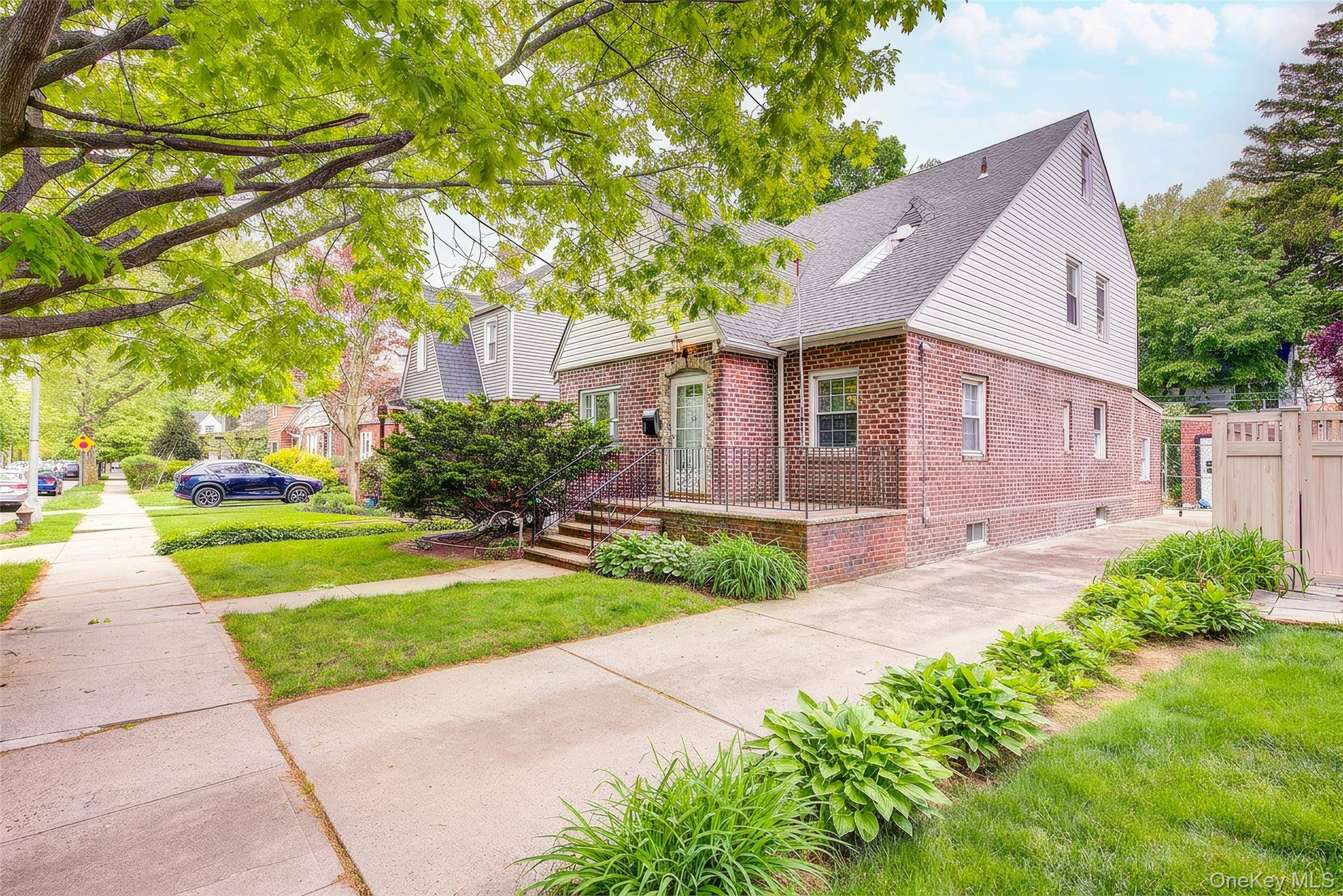 Welcome to this bright, eastern facing detached Tudor style single family home in the highly desirable Floral Park North area of Bellerose Manor.
