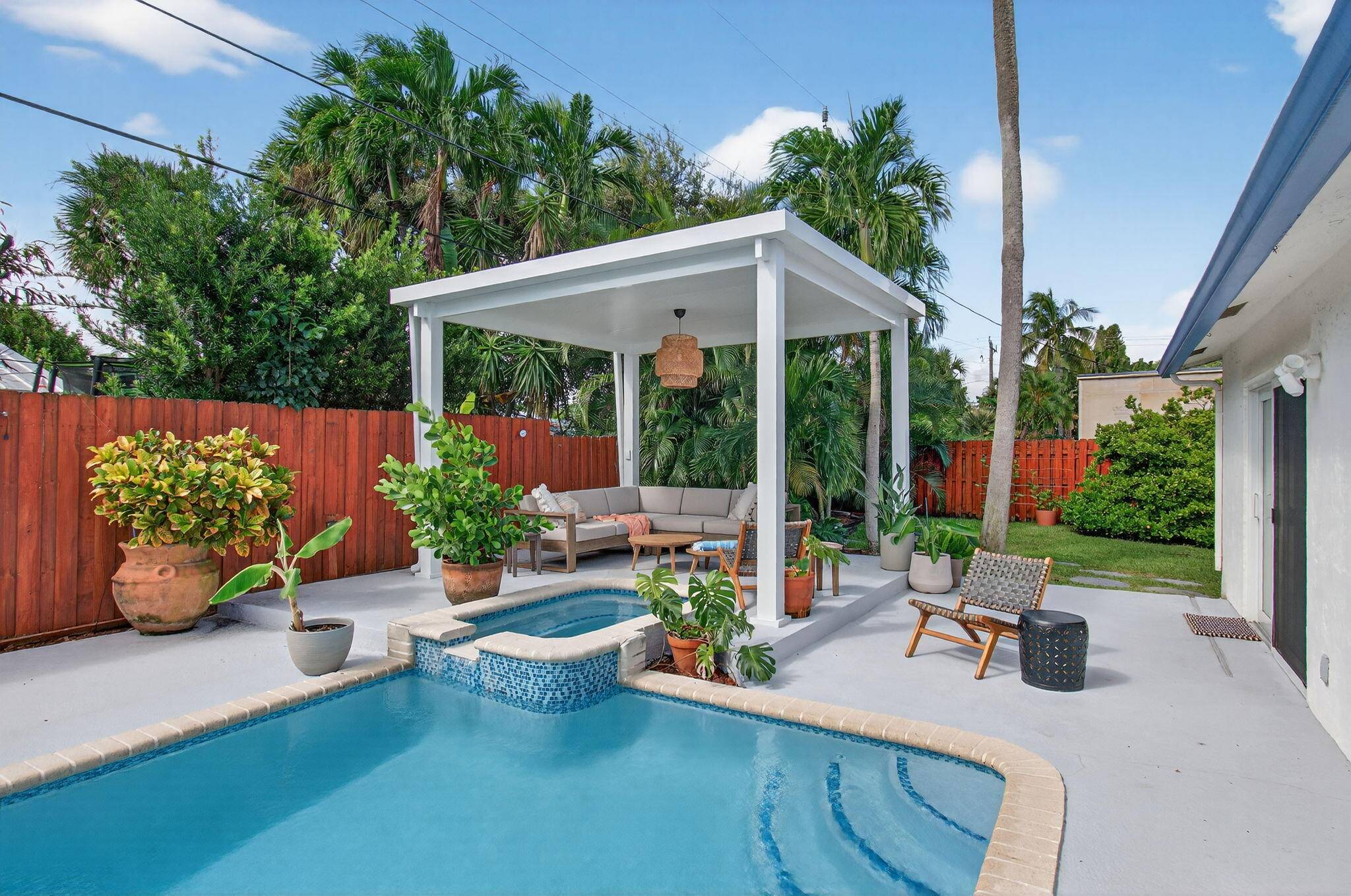 Welcome to 802 Mallard Drive, a seasonal rental in Delray's Tropic Palms designed for the ultimate vacation at home experience.