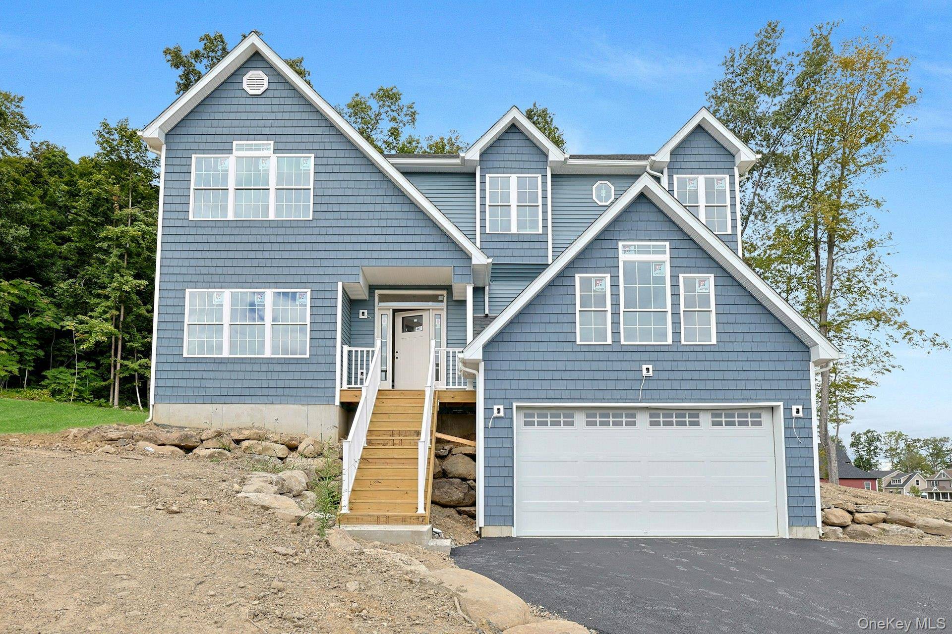 CRAFTSMAN STYLE MOUNTAIN VISTAS Luxury living in a prime location at Meadow Brook Estates welcomes you home to 16 McDonald Court, New Windsor, NY.