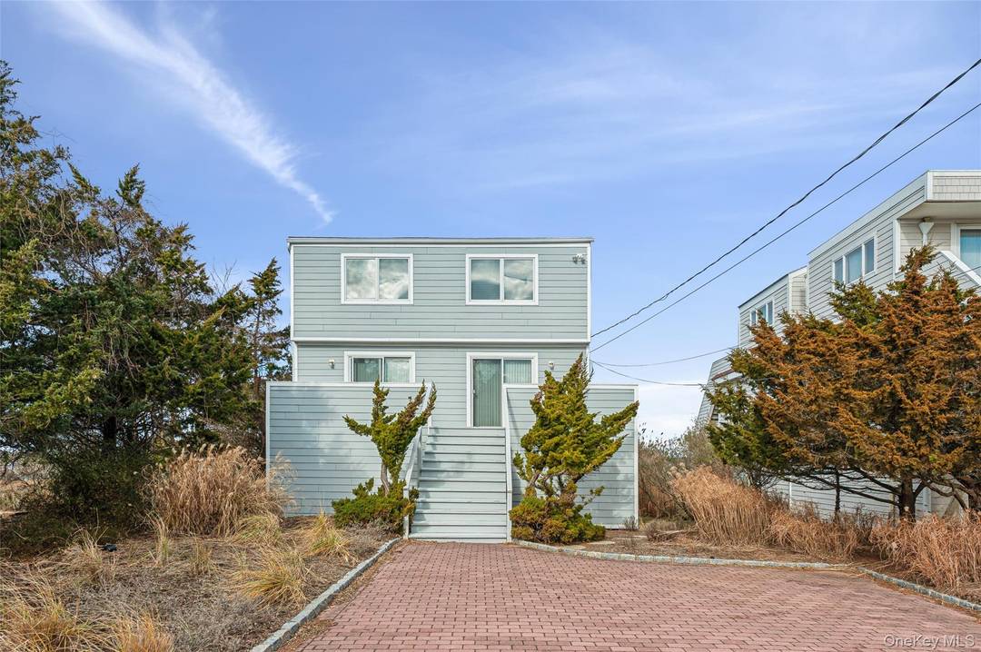 Westhampton Bayfront Escape to Dune Road, this 4 bedroom 2 Bathroom beach house offers a sandy bayfront beach and a deeded ROW to the ocean directly across the street.