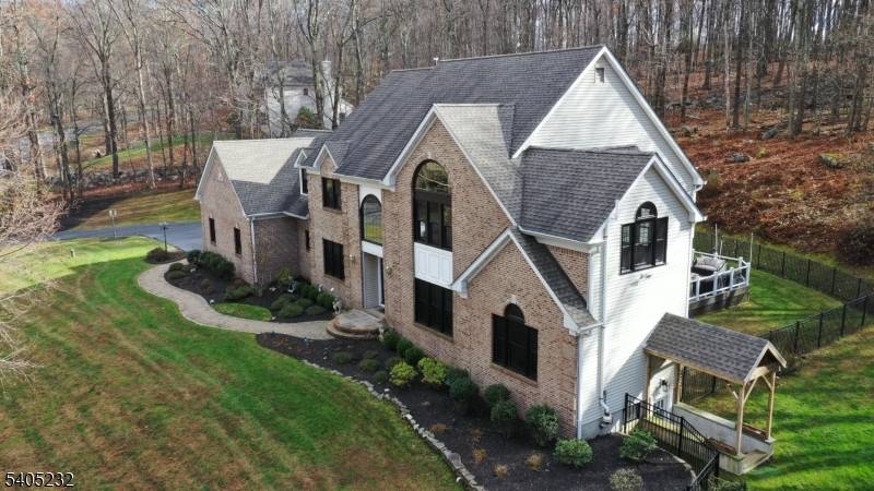 Your search ends here ! Stately brick, 5 bedroom colonial, located in the highly sought after neighborhood of Timber Hollow in Long Valley, featuring natural gas !