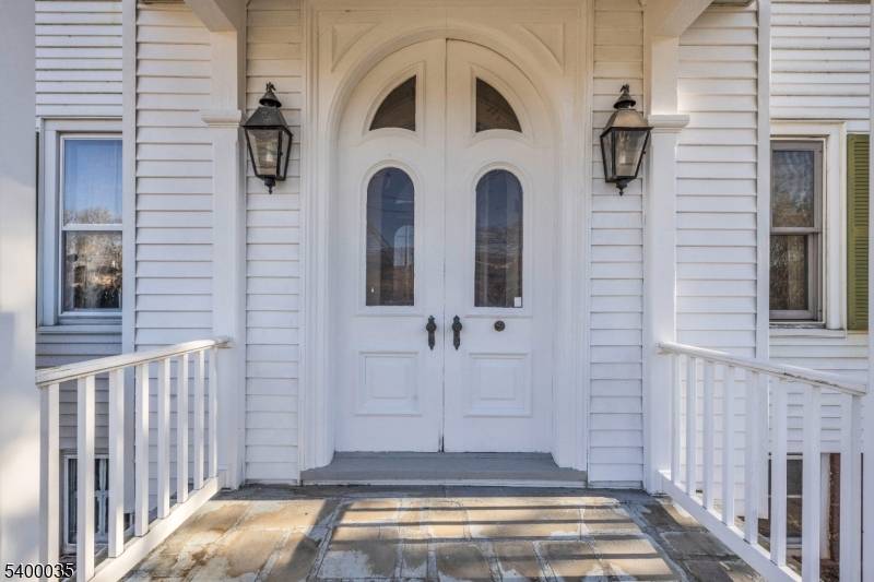 Stately Georgian Colonial, an architectural masterpiece with classical moldings and beautiful woodworking.