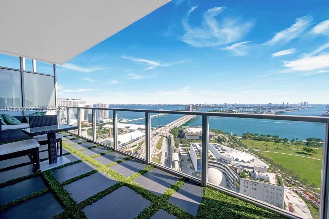 Enjoy breathtaking, unobstructed bay and ocean views from this impeccably finished residence, complete with private elevator entry.