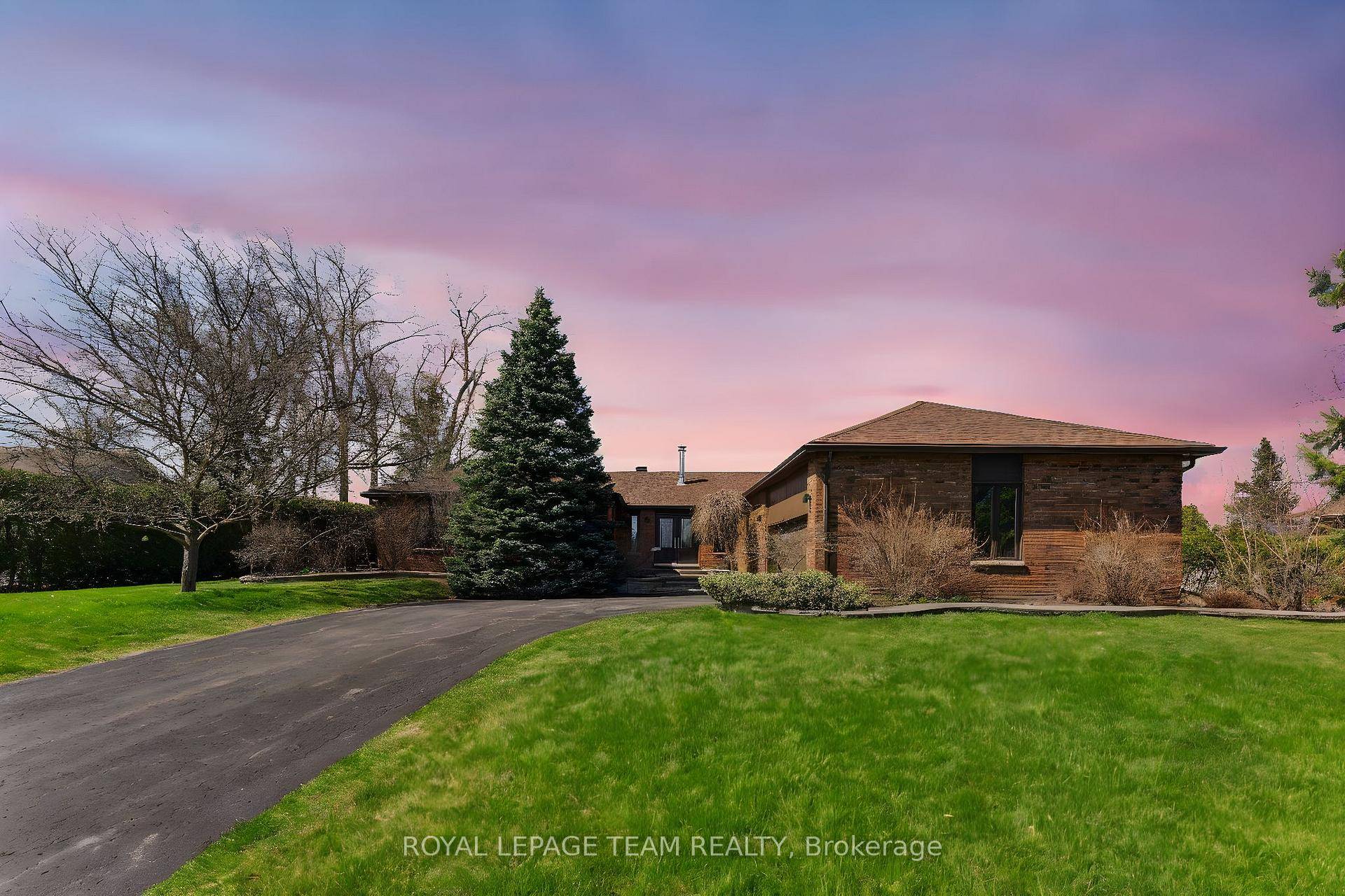 Presenting a meticulously maintained all brick bungalow with oversized double garage, situated on an expansive lot in the highly sought after community of Greely.