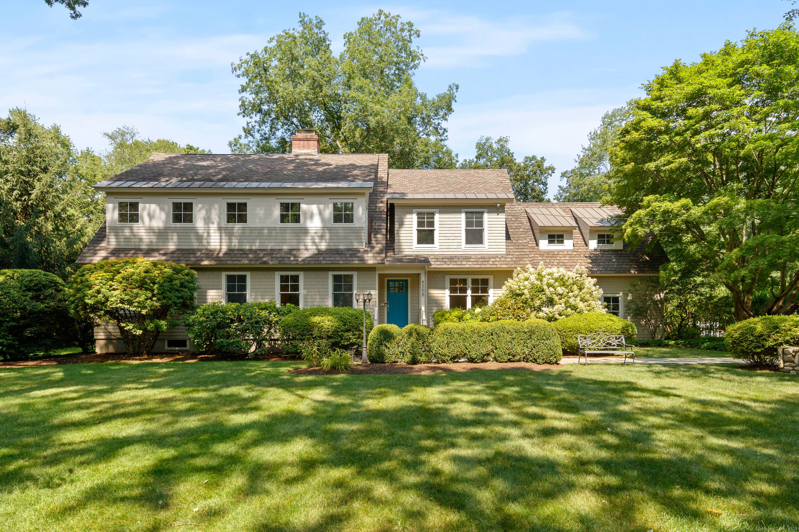Gorgeous Nantucket Style Retreat with Spacious Layout Private Backyard Set behind stately stone pillars, this stunning Nantucket shingle style home, fully renovated in 2010, offers timeless curb appeal and modern ...