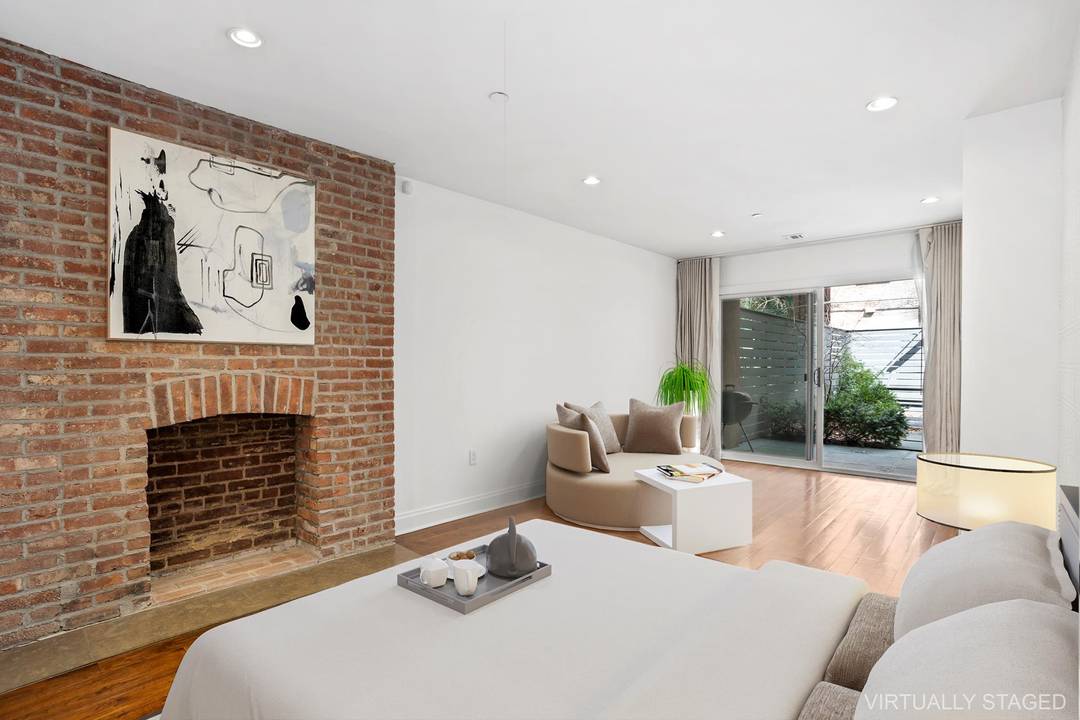 The largest 2 bedroom, 3 bathroom in Prime Harlem spanning through two full floors with Private Entrance, Recreation Room, Home Office, 2 Outdoor Spaces Private Garden and Rooftop.