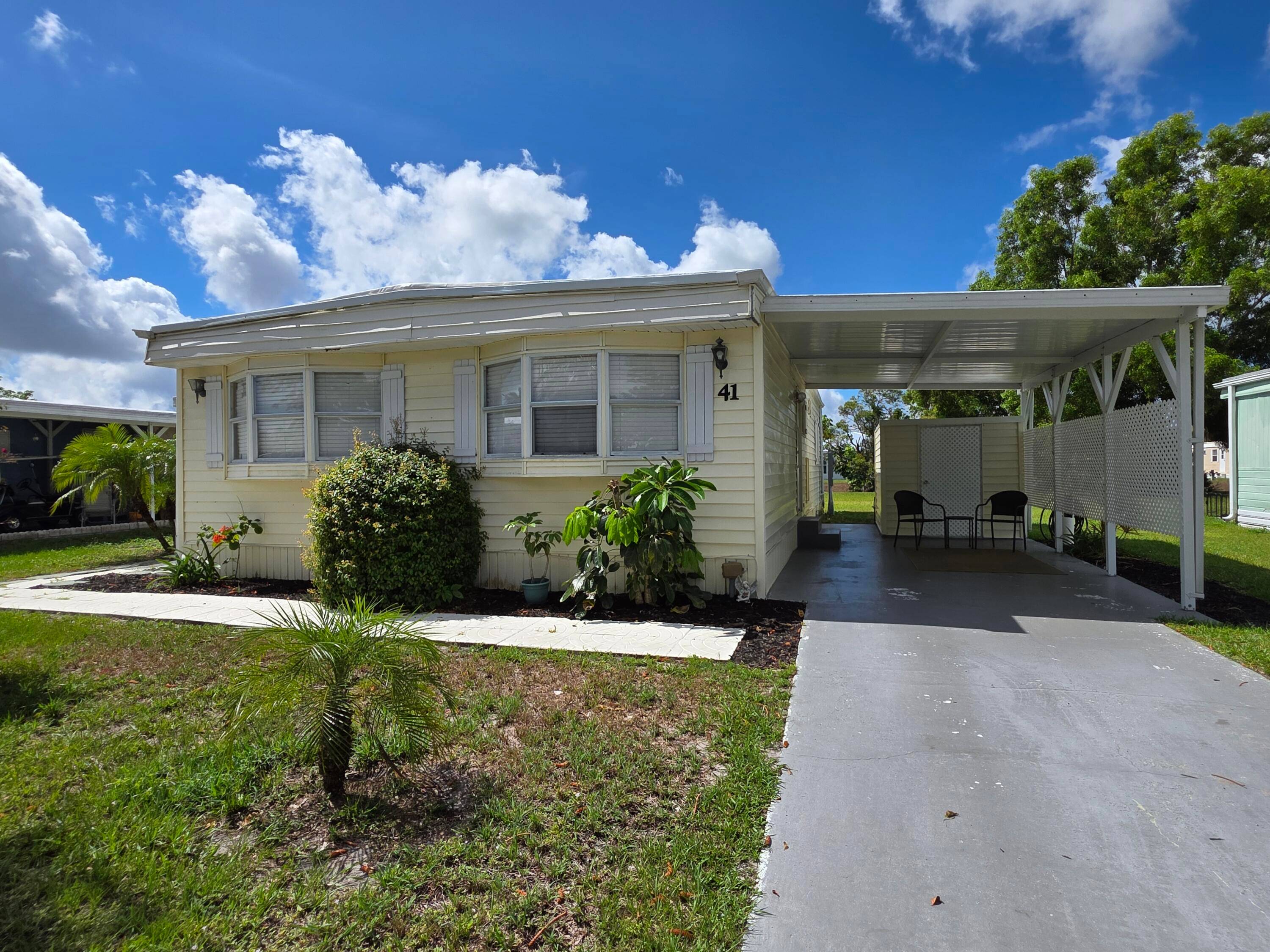 This beautifully maintained manufactured home comes fully furnished all nestled on an oversized lot with canal views.